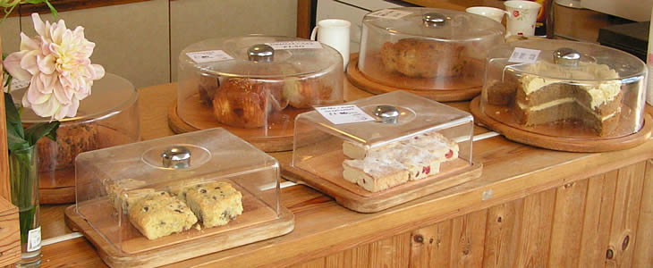 selection of locally produced cakes with tea, coffee or fruit juices
